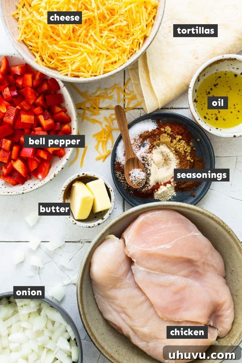 A vibrant display of fresh ingredients for sheet pan quesadillas, including chicken breasts, colorful bell peppers, onion, flour tortillas, shredded cheese, and various spices, arranged on a rustic wooden table.