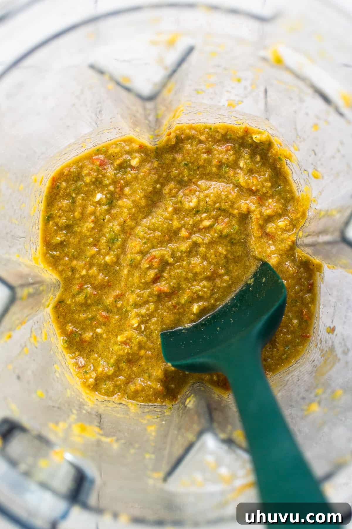 Vibrant Mexican Salsa 5 The vibrant green and red blend of Salsa Mexicana ingredients in a blender, demonstrating the smooth consistency after processing.