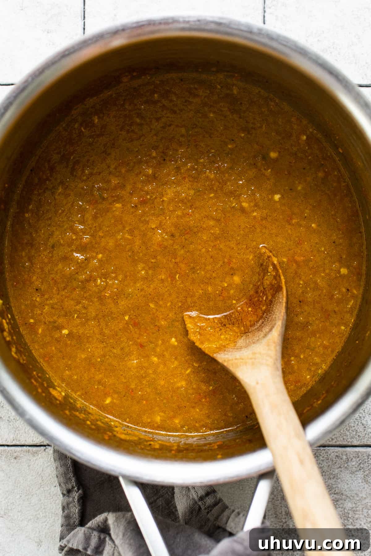 Vibrant Mexican Salsa 6 The blended Salsa Mexicana simmering gently in a saucepan on the stove, showing the cooking process that enhances its flavor.