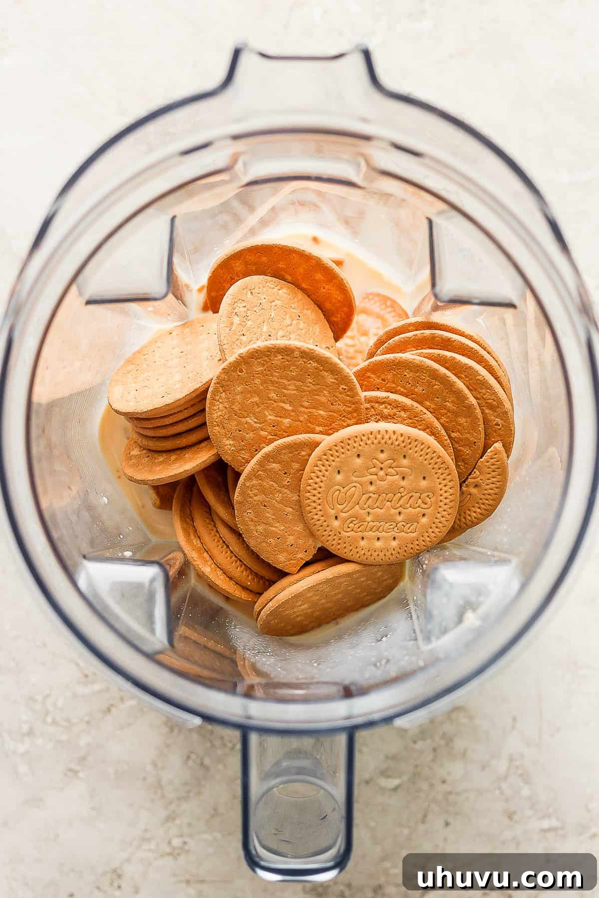 Homestyle María Biscuit Atole 5 Marias cookies in a blender with evaporated milk.