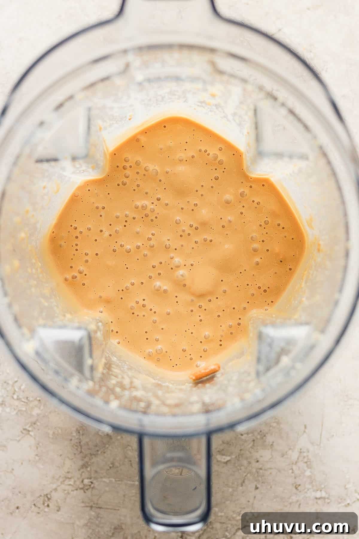 Homestyle María Biscuit Atole 6 Blended galletas marias and evaporated milk in a blender.