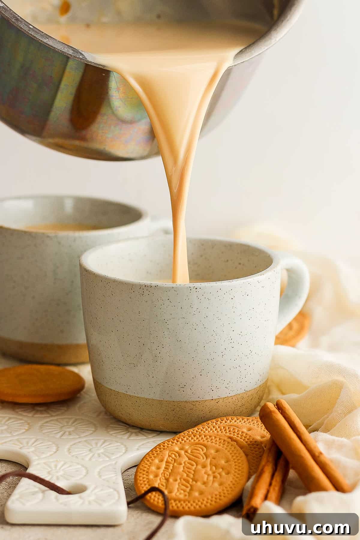 Homestyle María Biscuit Atole 9 Atole de galletas marias being poured into a mug.
