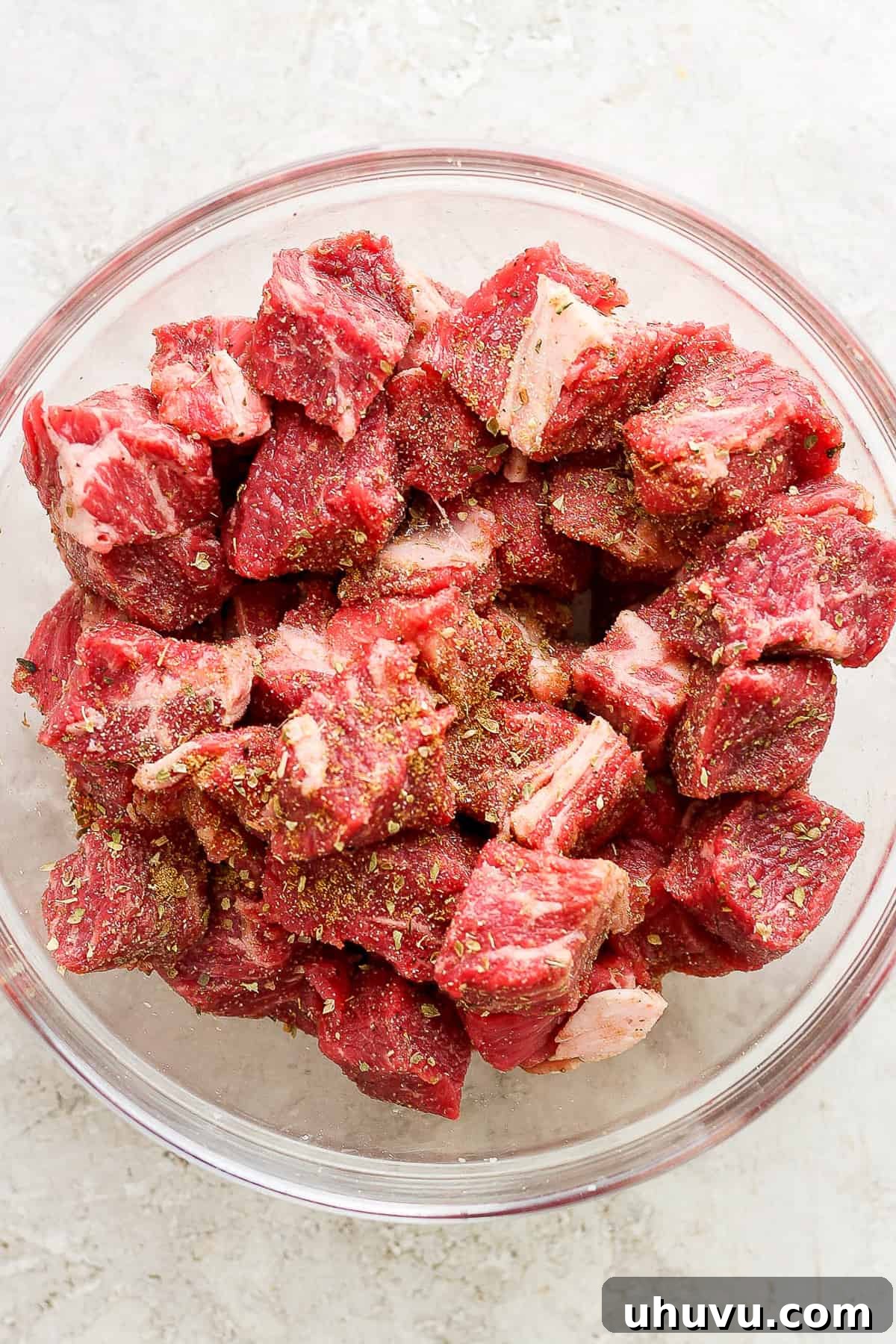 Homestyle Beef and Potatoes 4 Cubed beef chuck roast, generously seasoned with spices, resting in a large bowl, ready for browning.