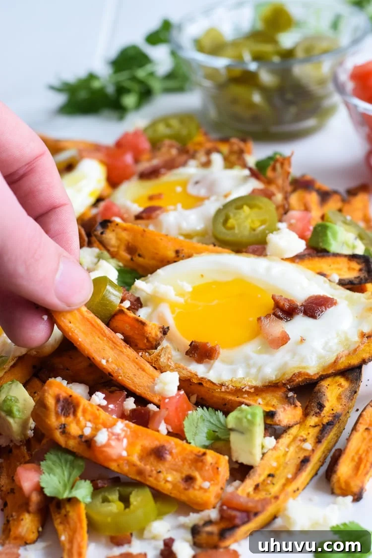 Sunrise Sweet Potato Stacks 2 Crispy Baked Loaded Sweet Potato Breakfast Fries with perfectly cooked eggs and bacon