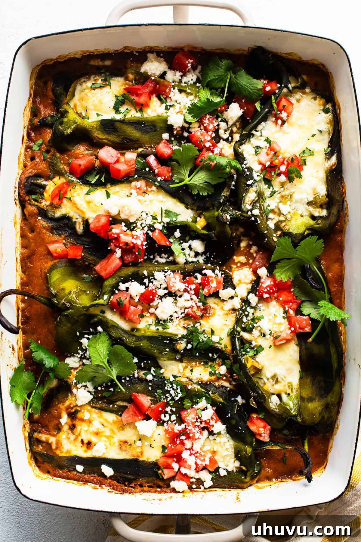 Easy Baked Chile Rellenos 8 A baking dish filled with several baked chile rellenos, fresh from the oven.