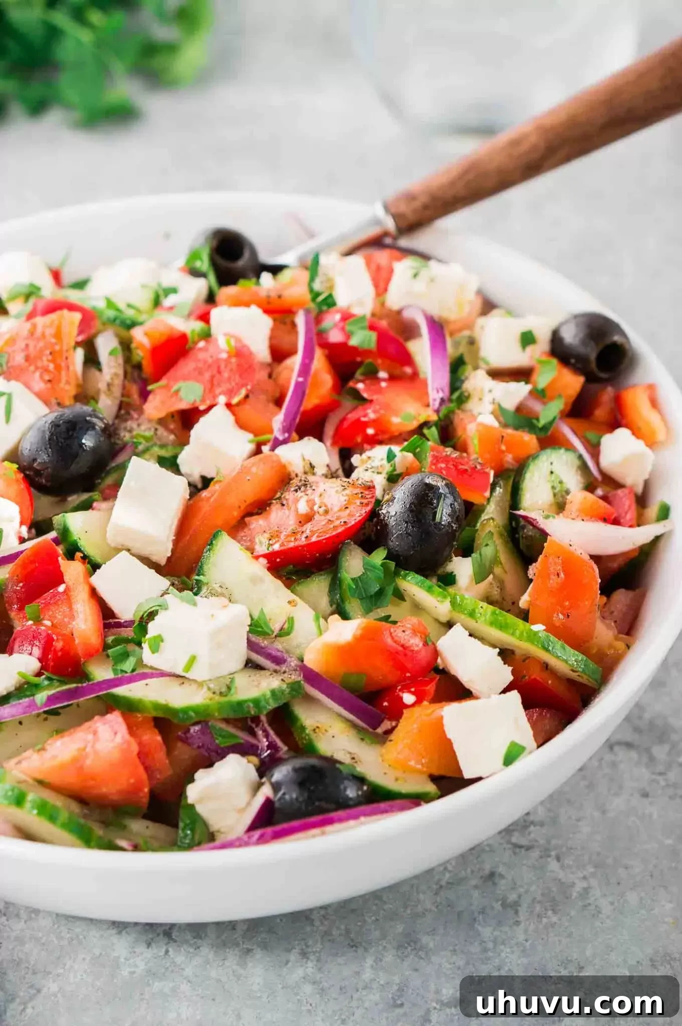 Close-up of a delicious tomato, cucumber, and feta salad in a bowl