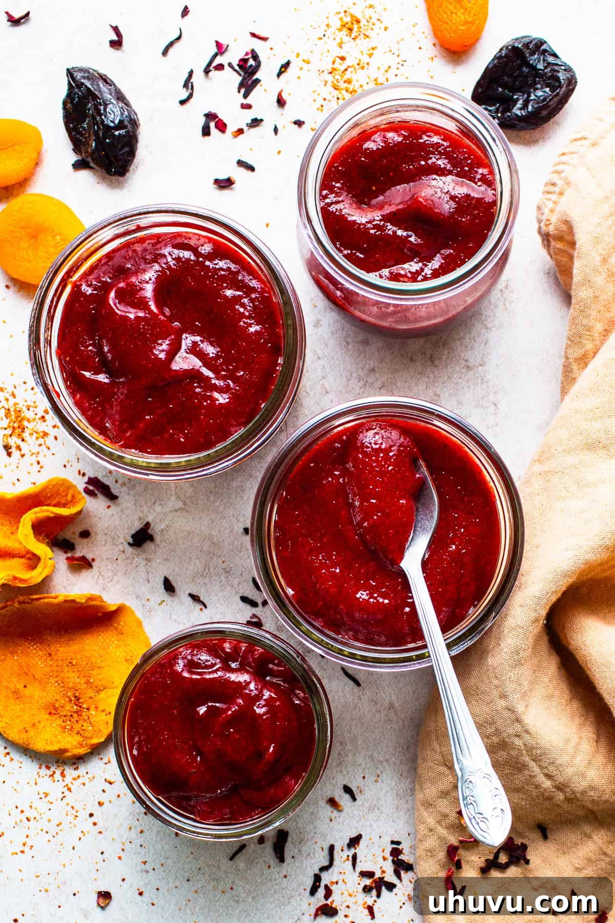 Homemade Chamoy Perfection 7 Rows of clear glass jars filled with freshly made homemade chamoy sauce, ready for storage or gifting, showcasing its vibrant color.