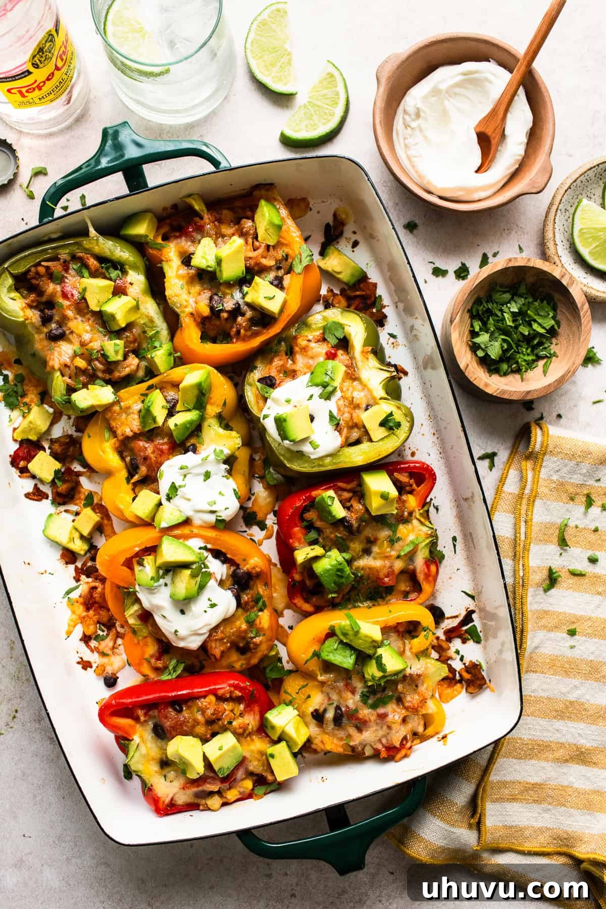 Fiesta Stuffed Peppers 7 Freshly baked Mexican Stuffed Peppers, garnished with sour cream, avocado, and cilantro, served hot from the oven.