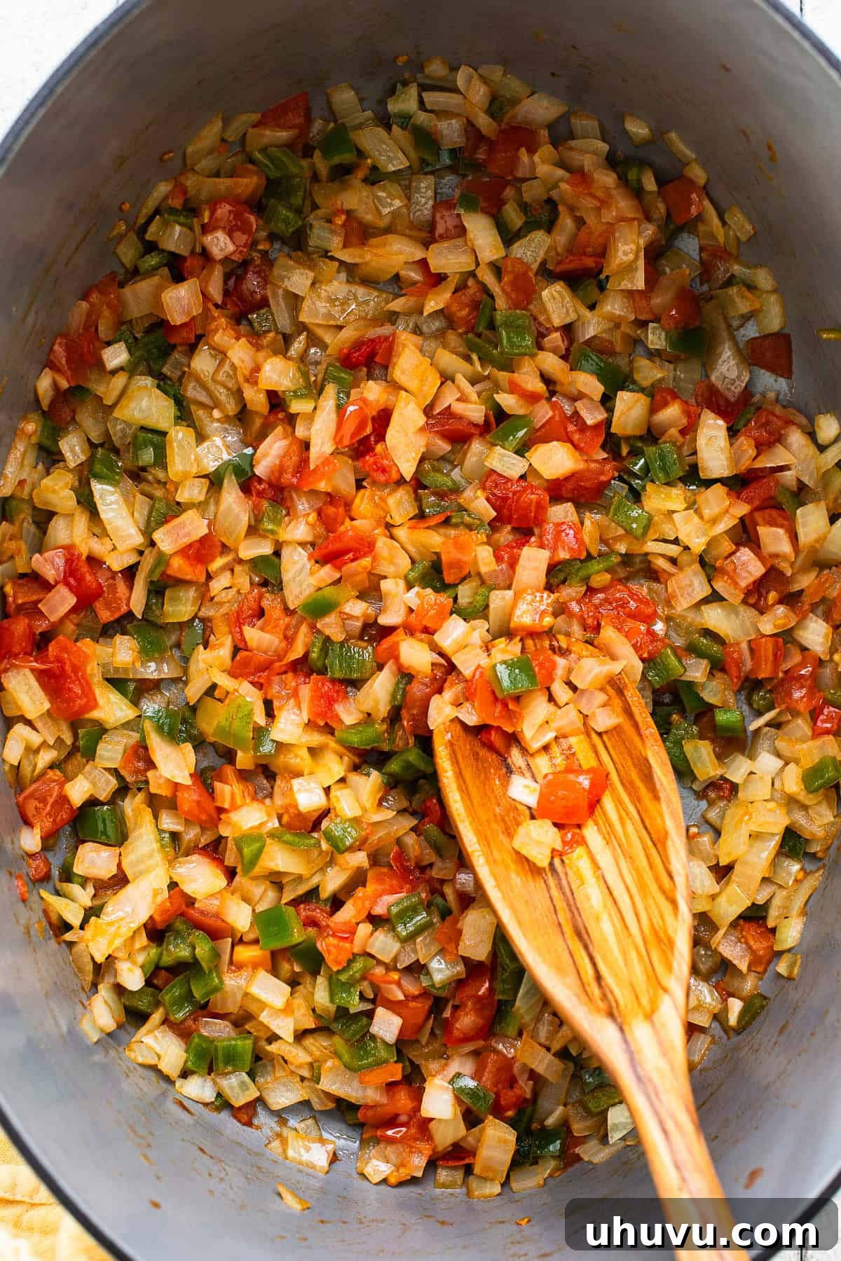 Authentic Yucatecan Lime Soup 4 Sauteed vegetables in a large pot.