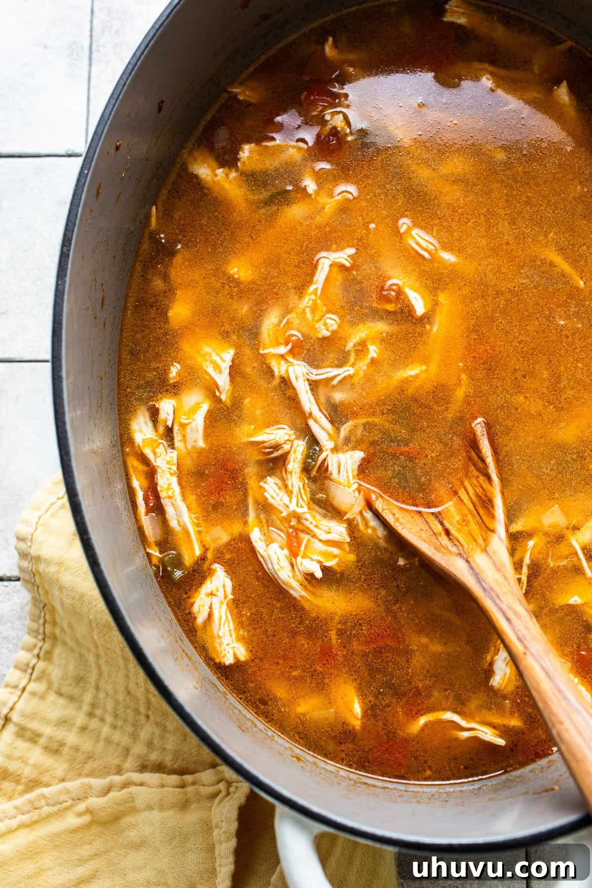 Authentic Yucatecan Lime Soup 7 Sopa de lima with shredded chicken in a pot before serving.