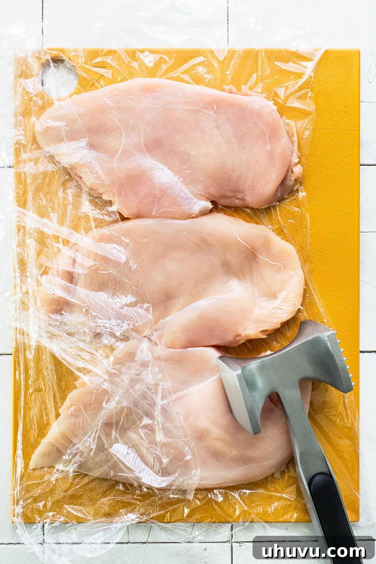 Zesty Tequila Lime Chicken 4 Raw chicken flattened by a meat mallet