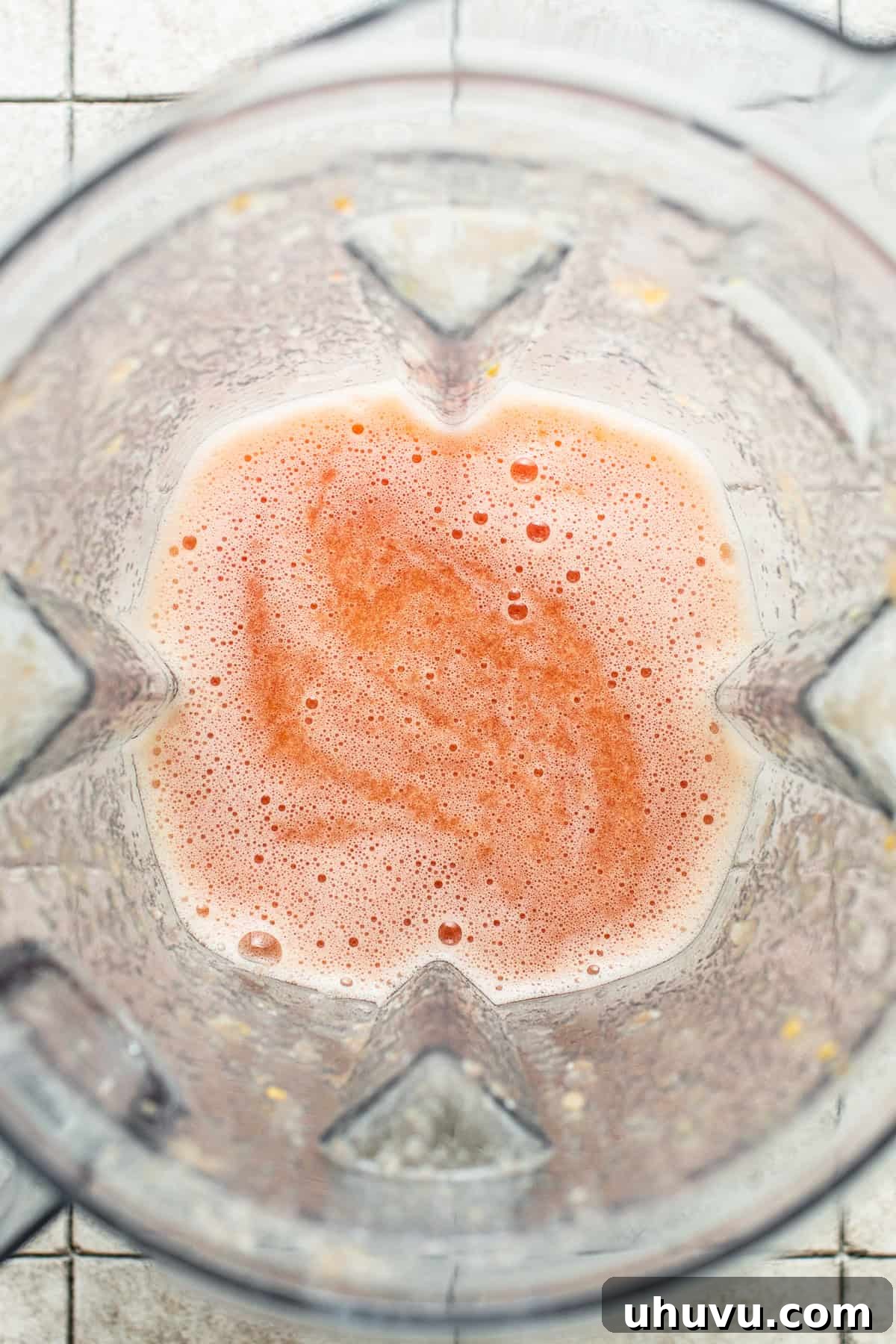 Crimson Spaghetti 4 Blended tomato mixture in a blender, showing the smooth, vibrant red sauce base.