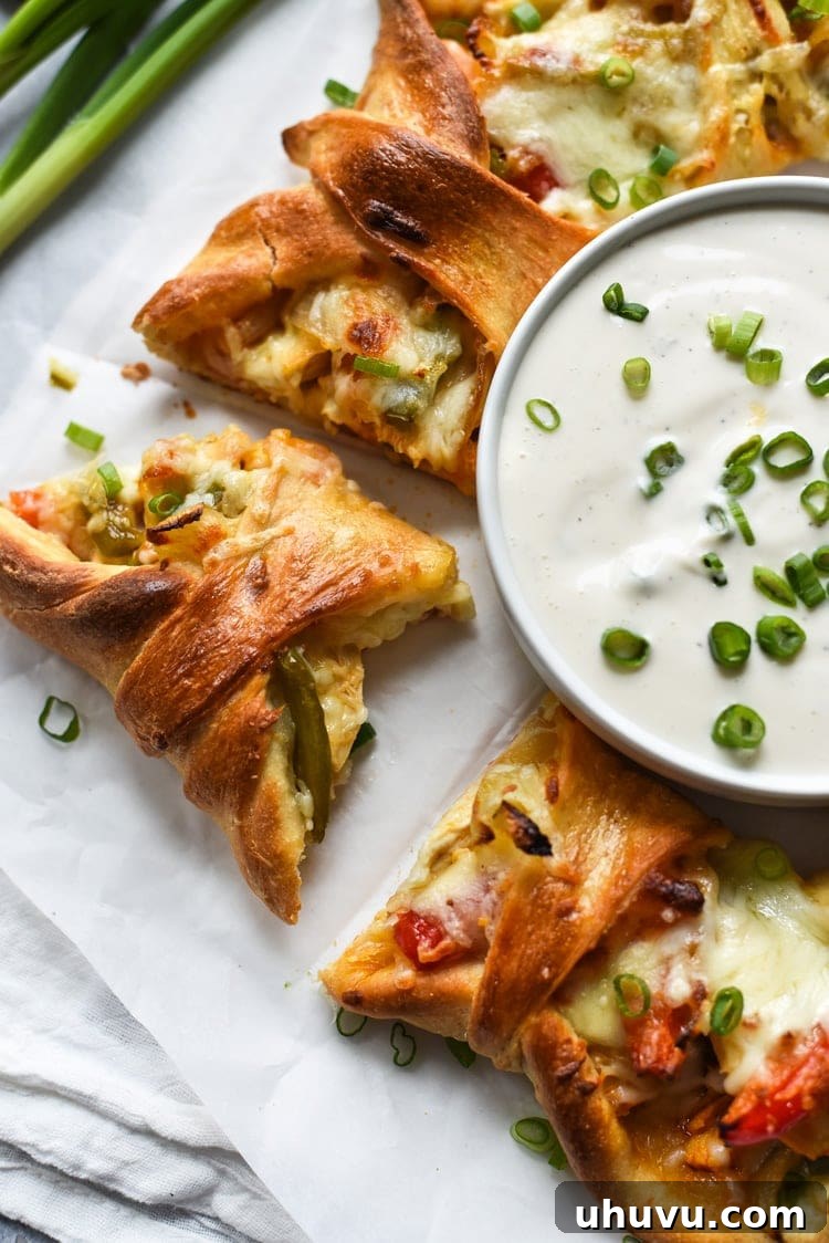 Buffalo Fajita Pizza Wreath 2 A beautifully baked Buffalo Chicken Fajita Pizza Ring, golden brown and ready to serve, perfect for parties and game day appetizers. The ring is filled with spicy chicken and colorful vegetables.