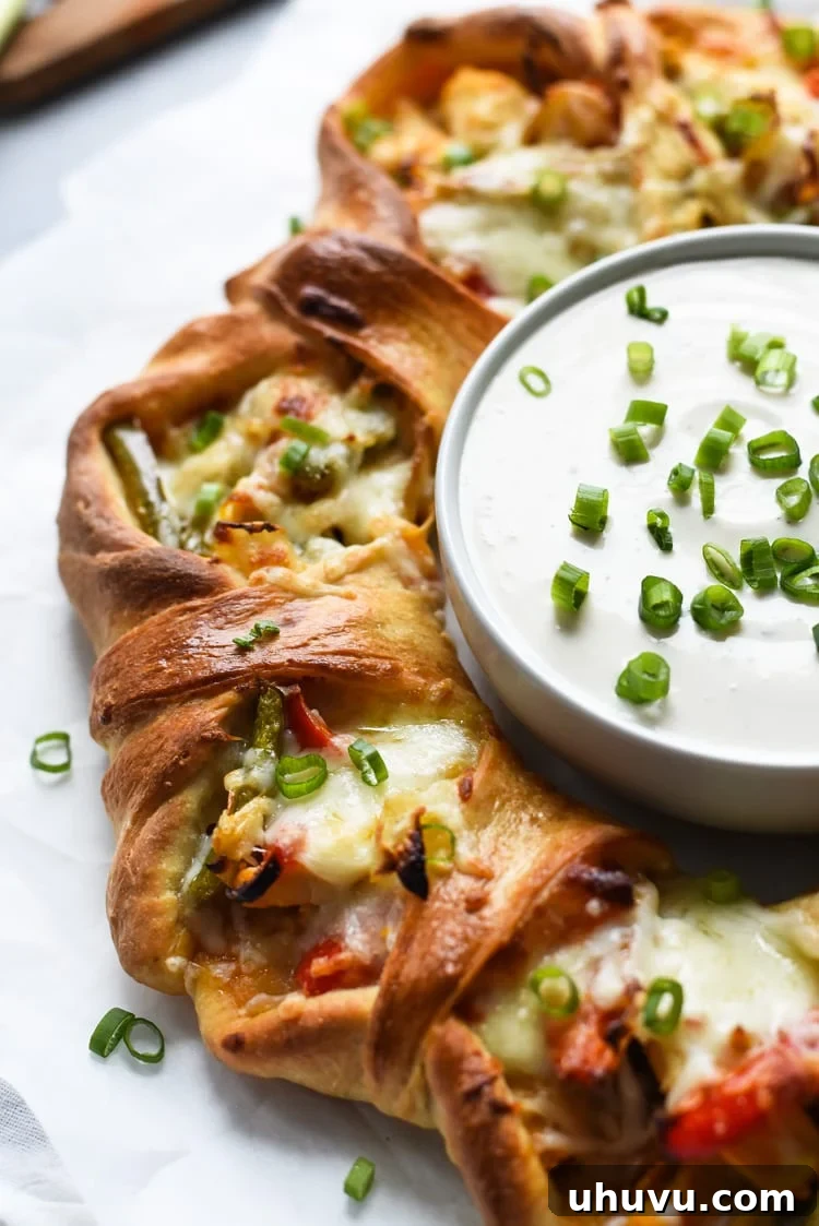 Buffalo Fajita Pizza Wreath 4 Another view of the Buffalo Chicken Fajita Pizza Ring on a serving plate, highlighting its perfect golden crust and the enticing filling.