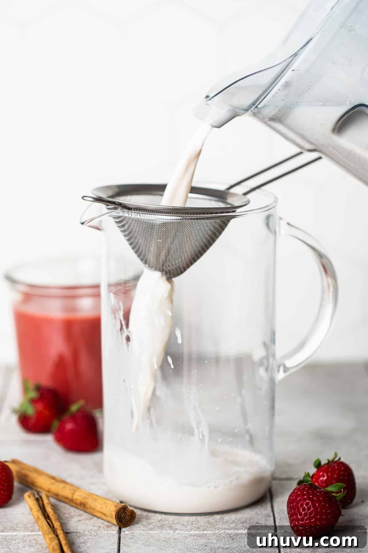 Strawberry Velvet Horchata 6 Strain the mixture into another pitcher