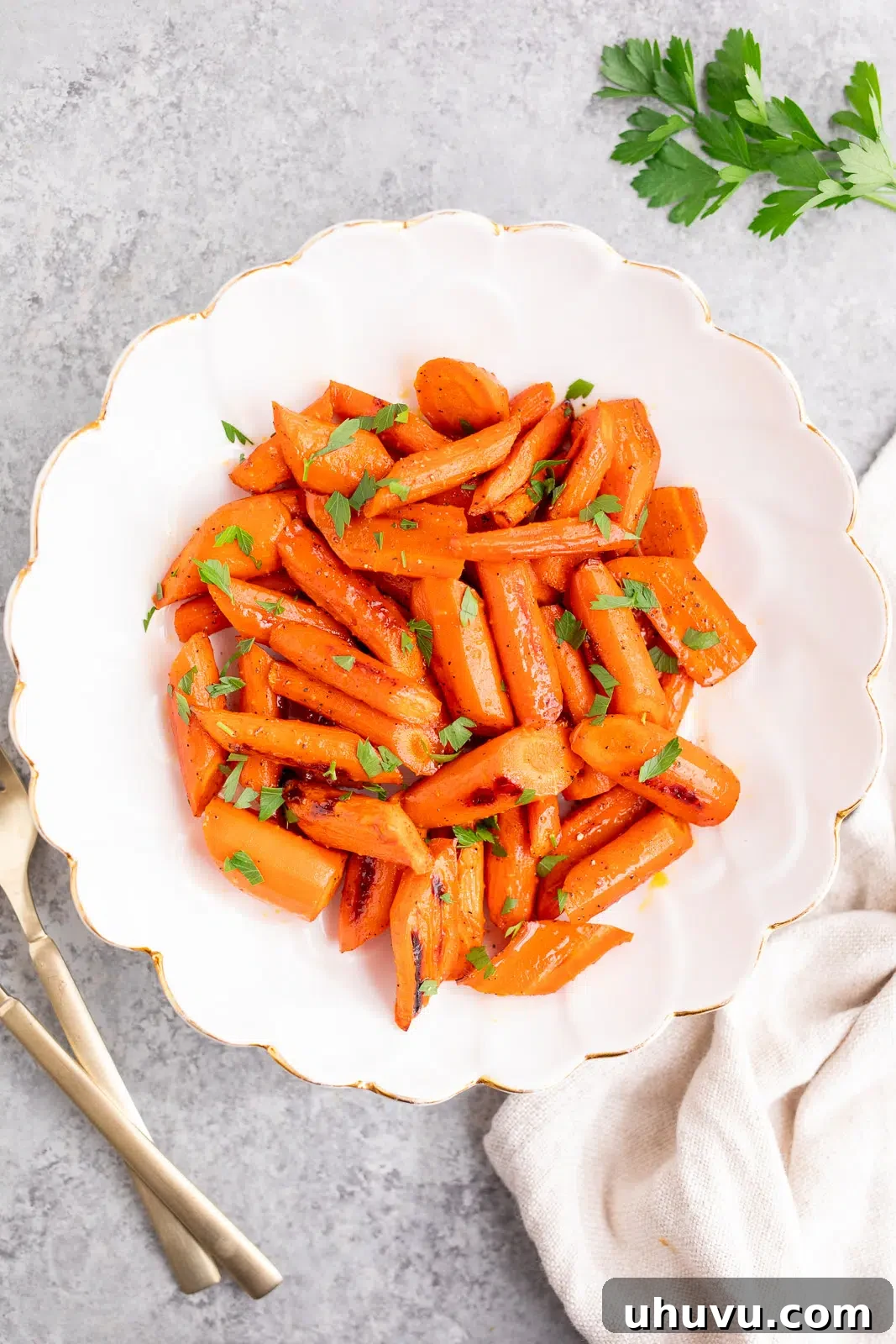 Golden Nectar Carrots 2 honey glazed carrots served in a white bowl