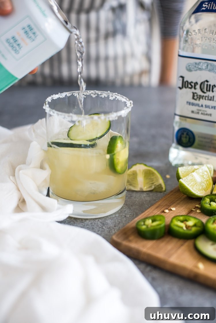 Cool Heat Margarita 4 Another perspective of the refreshing Cucumber Jalapeño Margarita, highlighting the vibrant green hues and inviting presentation.
