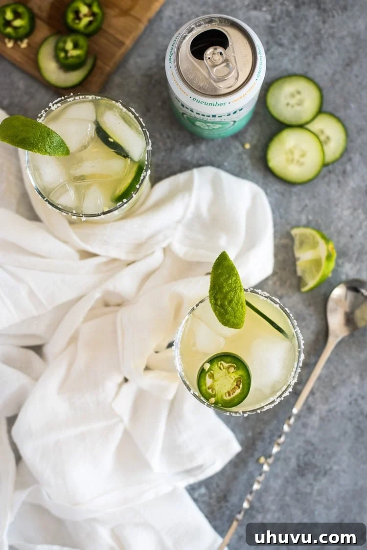 Cool Heat Margarita 6 A perfectly crafted Cucumber Jalapeño Margarita ready for a sunny day, showcasing its clear, inviting liquid and garnishes.