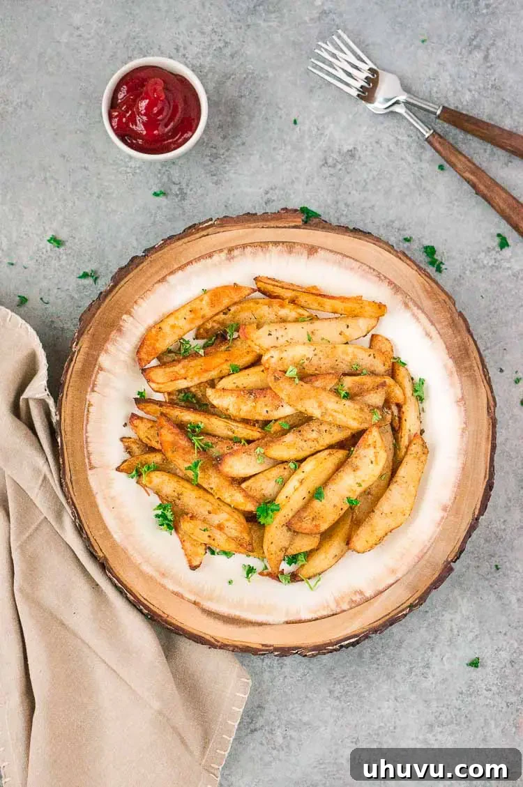 Baked potato slices arranged neatly on a plate for serving