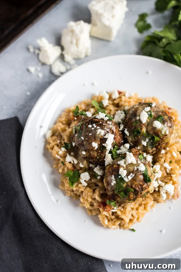 These Mexican Turkey Meatballs made with cilantro, garlic and a packet of taco seasoning are a great appetizer or weeknight meal when served with Arroz Verde (green chile rice).
