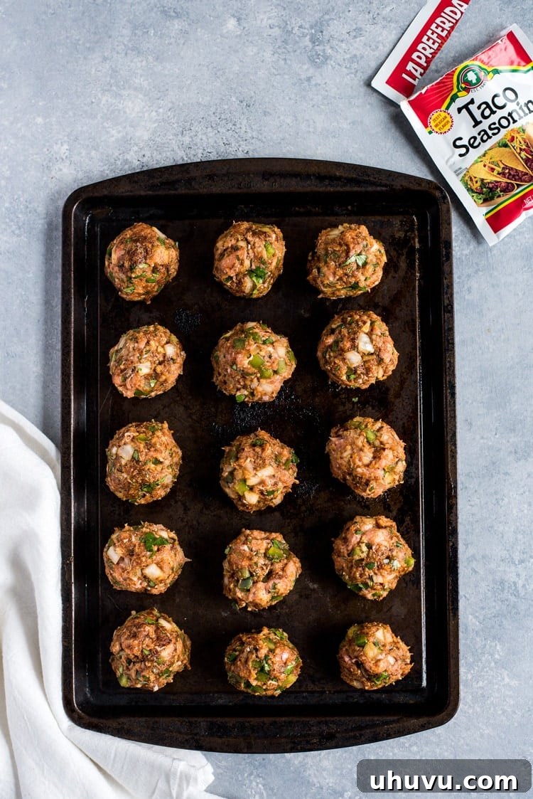 These Mexican Turkey Meatballs made with cilantro, garlic and a packet of taco seasoning are a great appetizer or weeknight meal when served with Arroz Verde (green chile rice).