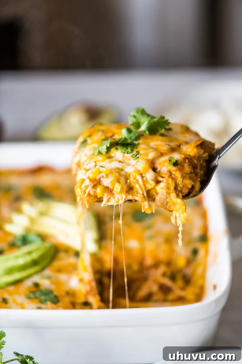 Southwest Chicken Tamale Bake 4 A spatula holding a slice of chicken tamale casserole.