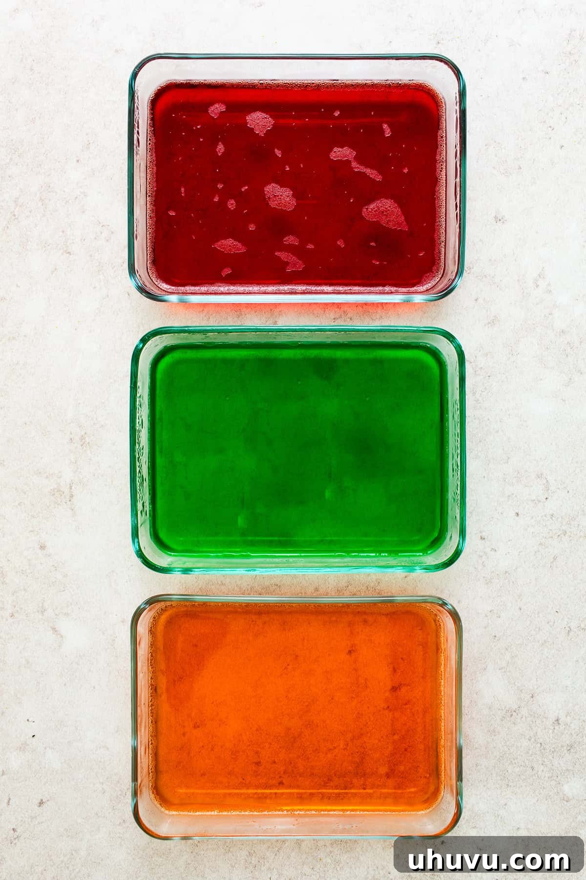 Mosaic Gelatin 4 Three different flavors of jello, set firmly in rectangular containers, ready for the next step of the Gelatina de Mosaico recipe.