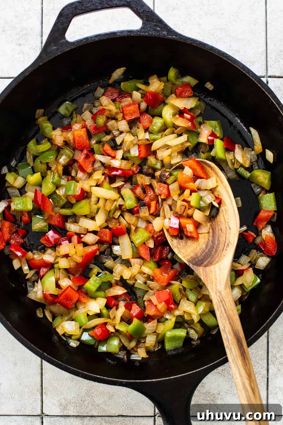 Zesty Chicken Fajita Quesadilla 4 Diced onions and bell peppers sautéing in a hot skillet, becoming tender and slightly caramelized.