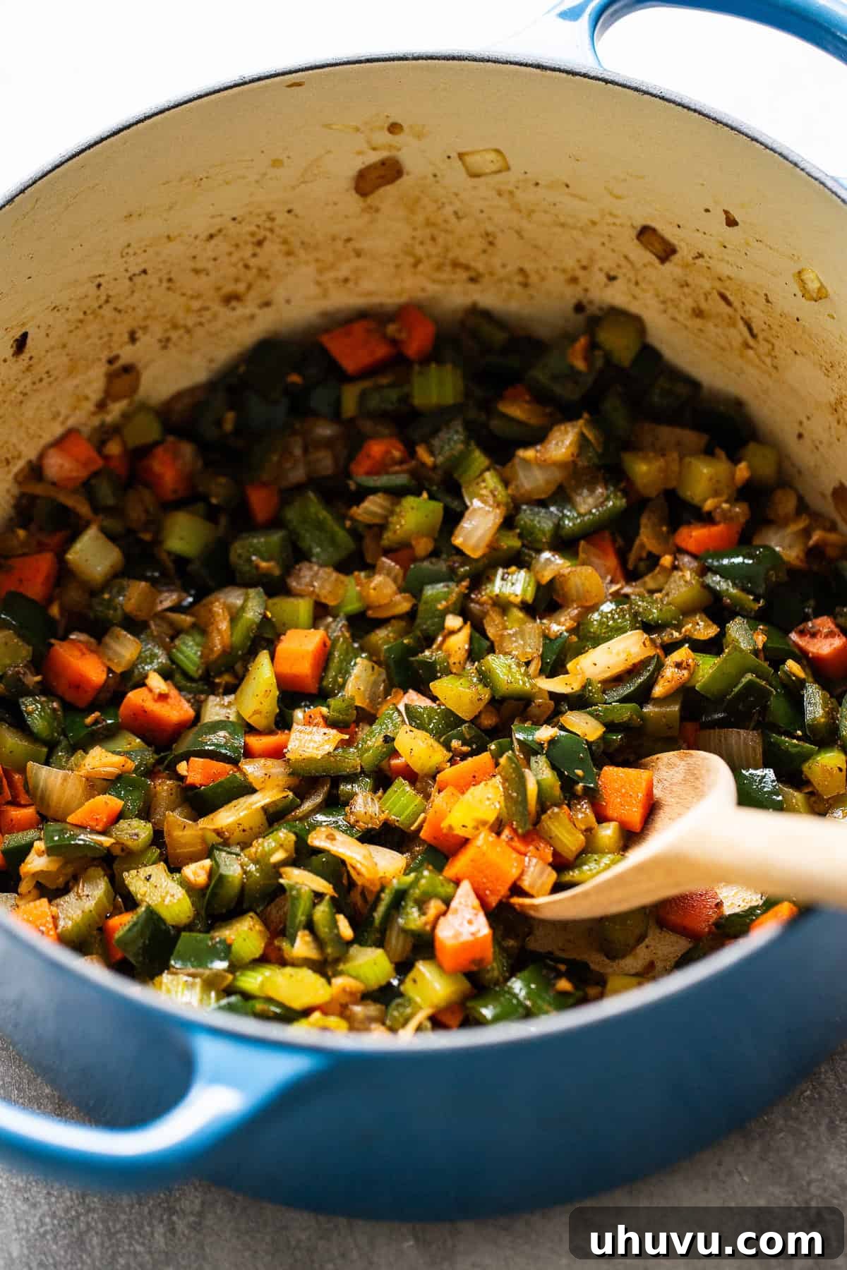 Smoky Chicken Poblano Soup 4 Dutch oven filled with sauteed vegetables and garlic.