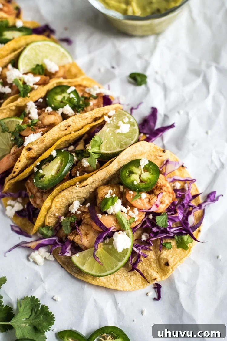 Sweet and savory Honey Balsamic Beer Shrimp Tacos, garnished with fresh toppings, ready in 30 minutes.