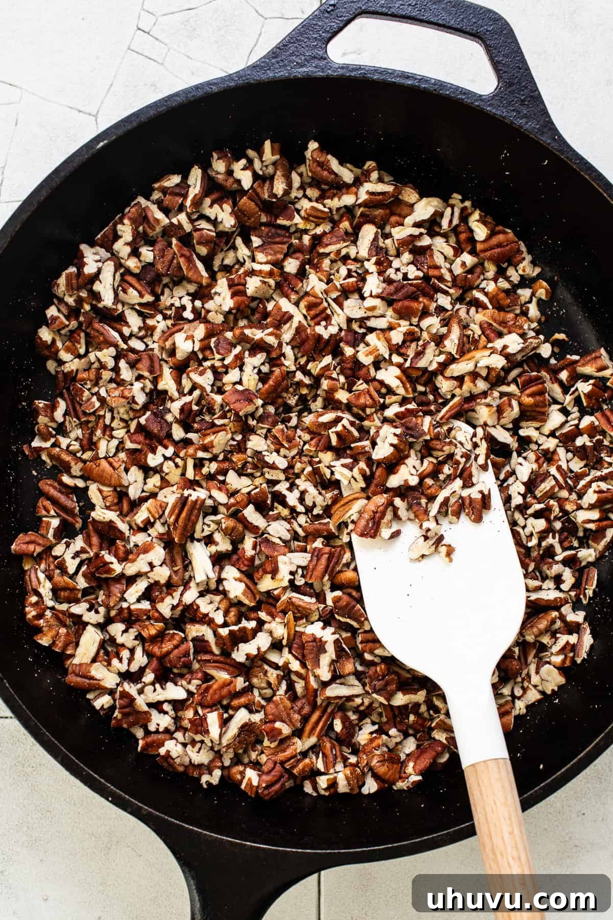 Cozy Walnut Brew 4 Pecans toasting gently in a large skillet over medium heat, releasing their fragrant oils.