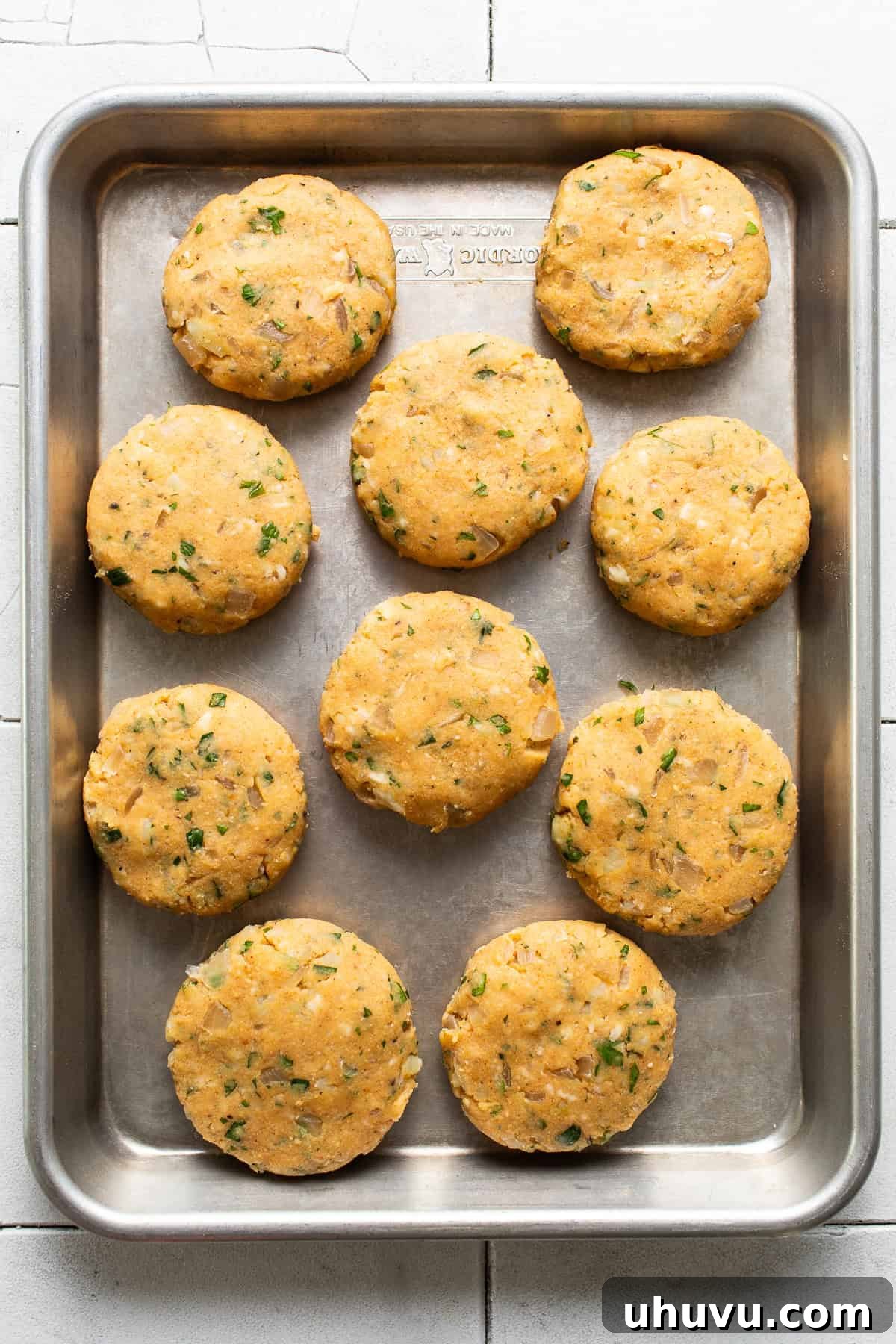 Potato Pancakes 5 Baking sheet lined with the potato mixture shaped patties.