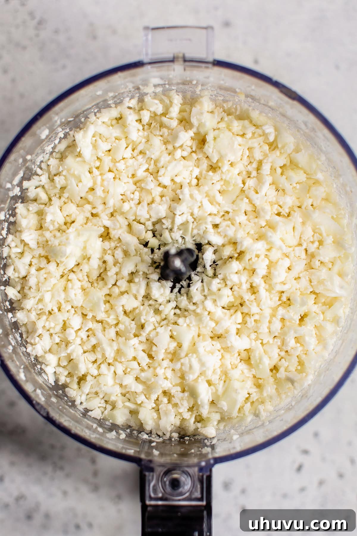 Zesty Cilantro-Lime Cauliflower Rice 4 Cauliflower florets riced in a food processor.