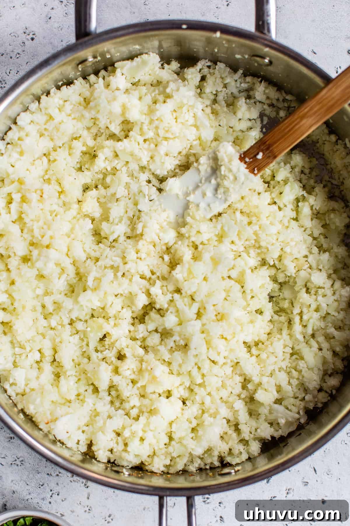 Zesty Cilantro-Lime Cauliflower Rice 5 Riced cauliflower sauteed in a skillet with onions and garlic.