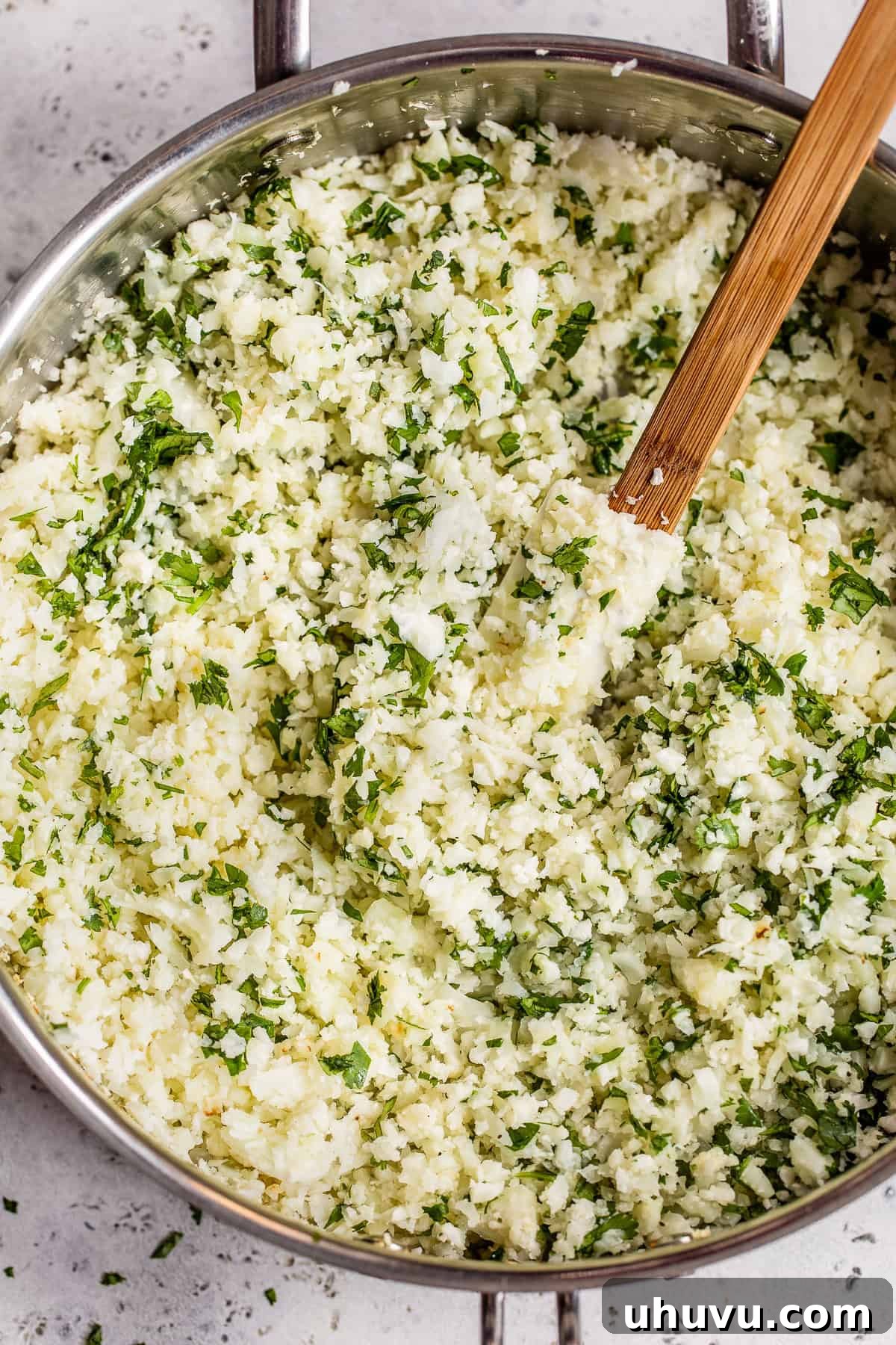 Zesty Cilantro-Lime Cauliflower Rice 7 Cilantro Lime Cauliflower Rice ready to be served in a skillet.