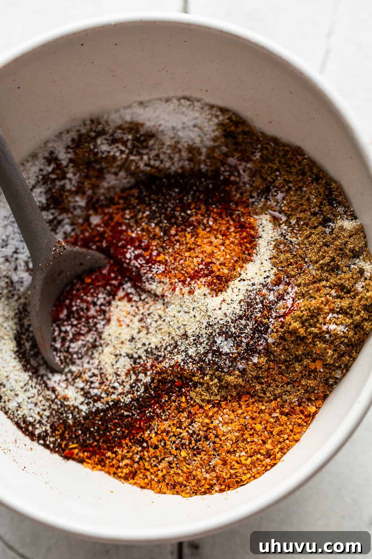 Sizzling Fajita Spice 4 Fajita seasoning ingredients in a bowl before being mixed together.