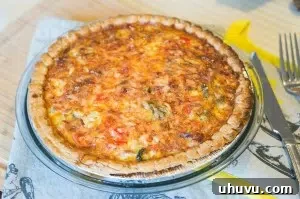 Slice of Quiche Lorraine showing the rich filling