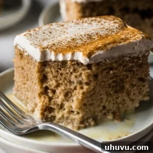 Apple tres leches cake on a plate.