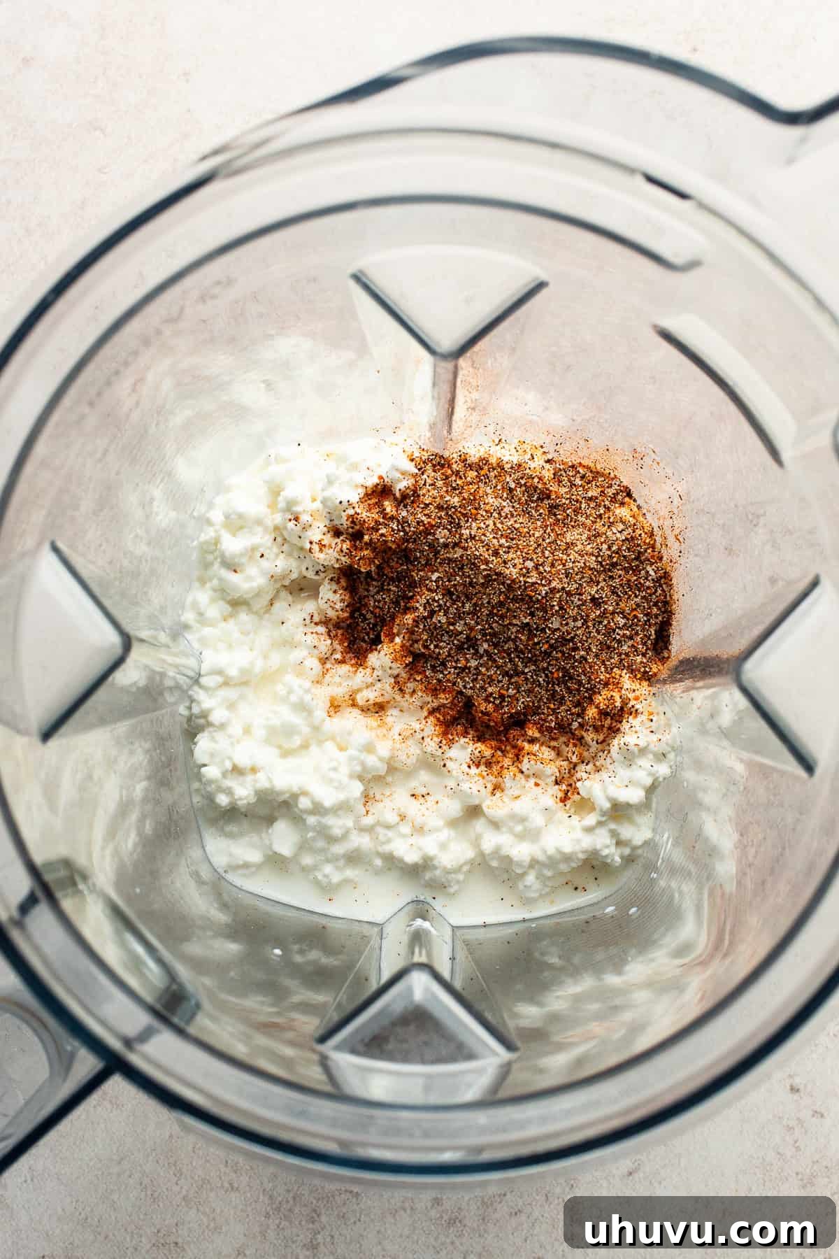 Creamy Cottage Queso 5 Step 1: Cottage cheese, milk, and taco seasoning in a blender.