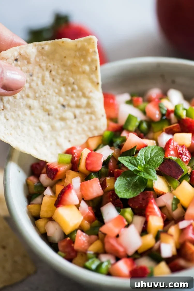 A beautifully composed shot of Peach Strawberry Salsa, showcasing its freshness and appealing colors.