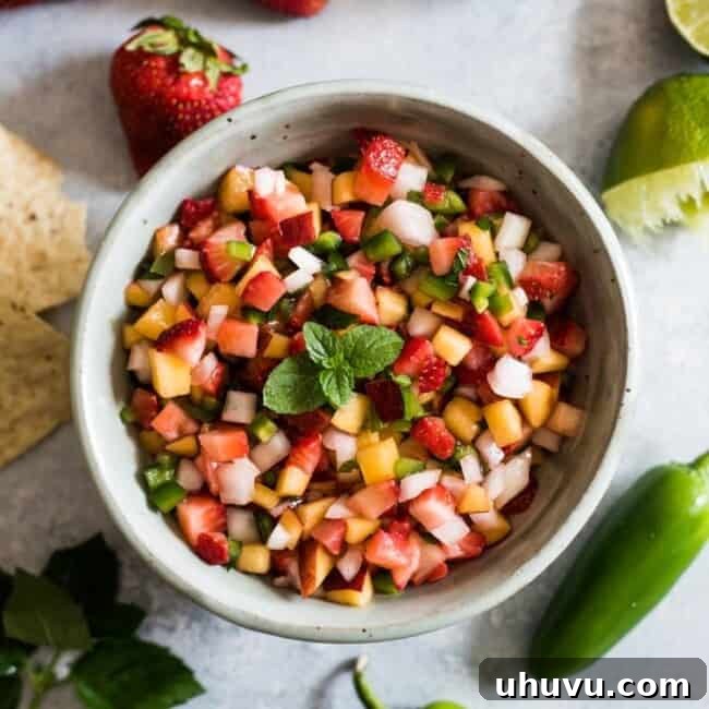 Appetizing Peach Strawberry Salsa in a vibrant serving bowl.