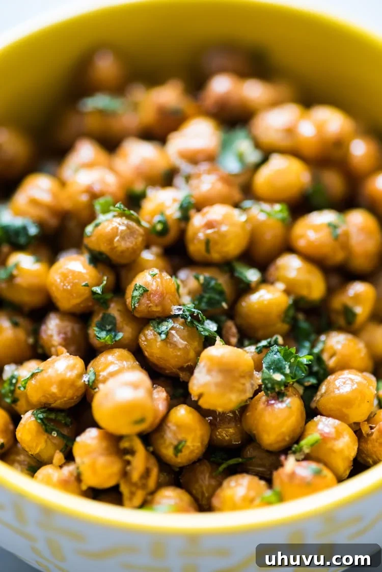 Zesty Cilantro Lime Roasted Chickpeas 6 A baking sheet filled with golden-brown, crunchy Cilantro Lime Roasted Chickpeas, recently pulled from the oven and cooling.