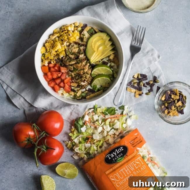A bright, fresh Mexican Chimichurri Chicken Salad featuring grilled corn, summer tomatoes, marinated and grilled chimichurri chicken and creamy avocados. (gluten free)