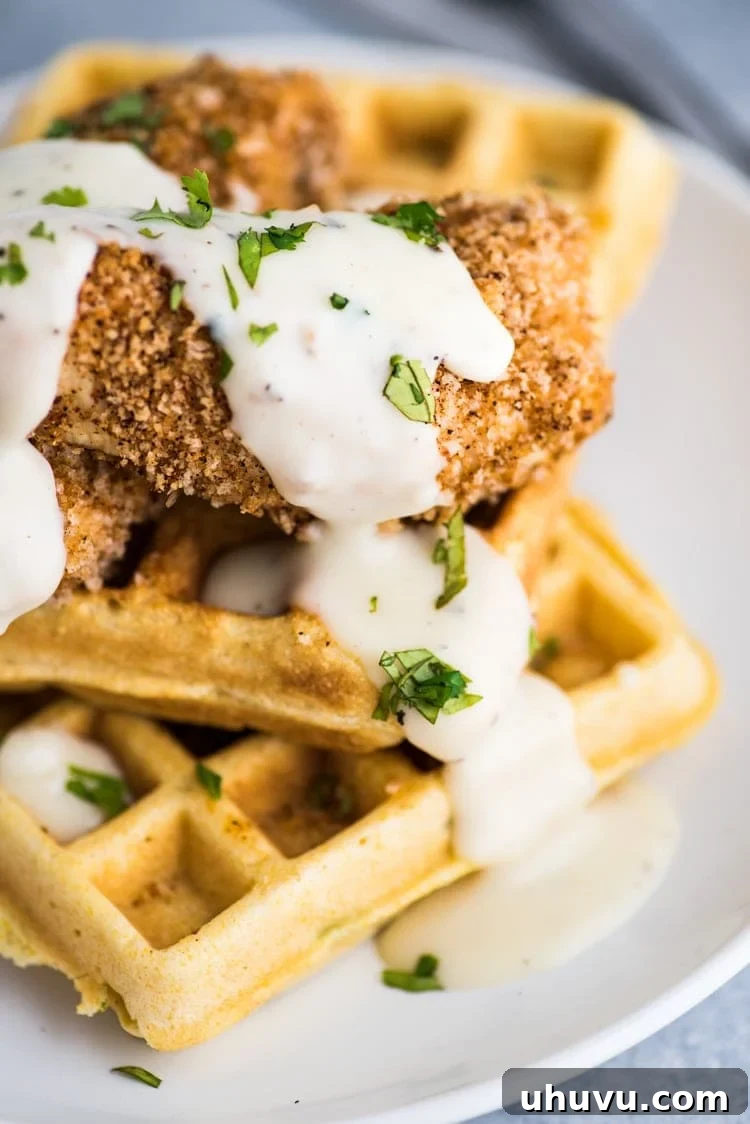 Crispy oven baked chicken tenders and white gravy served on savory Jalapeno Cornbread waffles for the ultimate brunch dish.