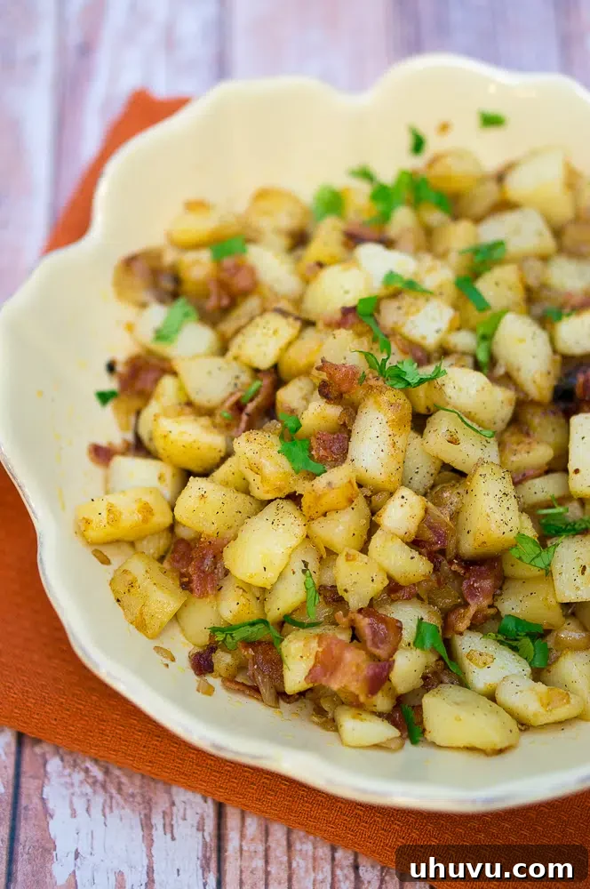 Golden brown German Pan Fried Potatoes (Bratkartoffeln) with bacon and onions