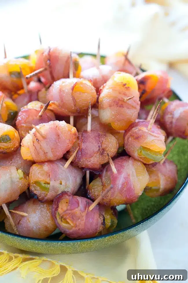 Fiery Apricot-Bacon Bundles 7 A full tray of cooked bacon-wrapped apricots with jalapeño, showcasing their perfectly crisp bacon and glossy apricots.