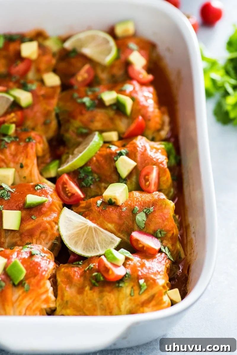Keto Enchilada Cabbage Wraps 2 These Low Carb Enchilada Cabbage Rolls are a delicious and healthy weeknight meal, featuring tender cabbage leaves filled with chicken, cheese, and green chiles.