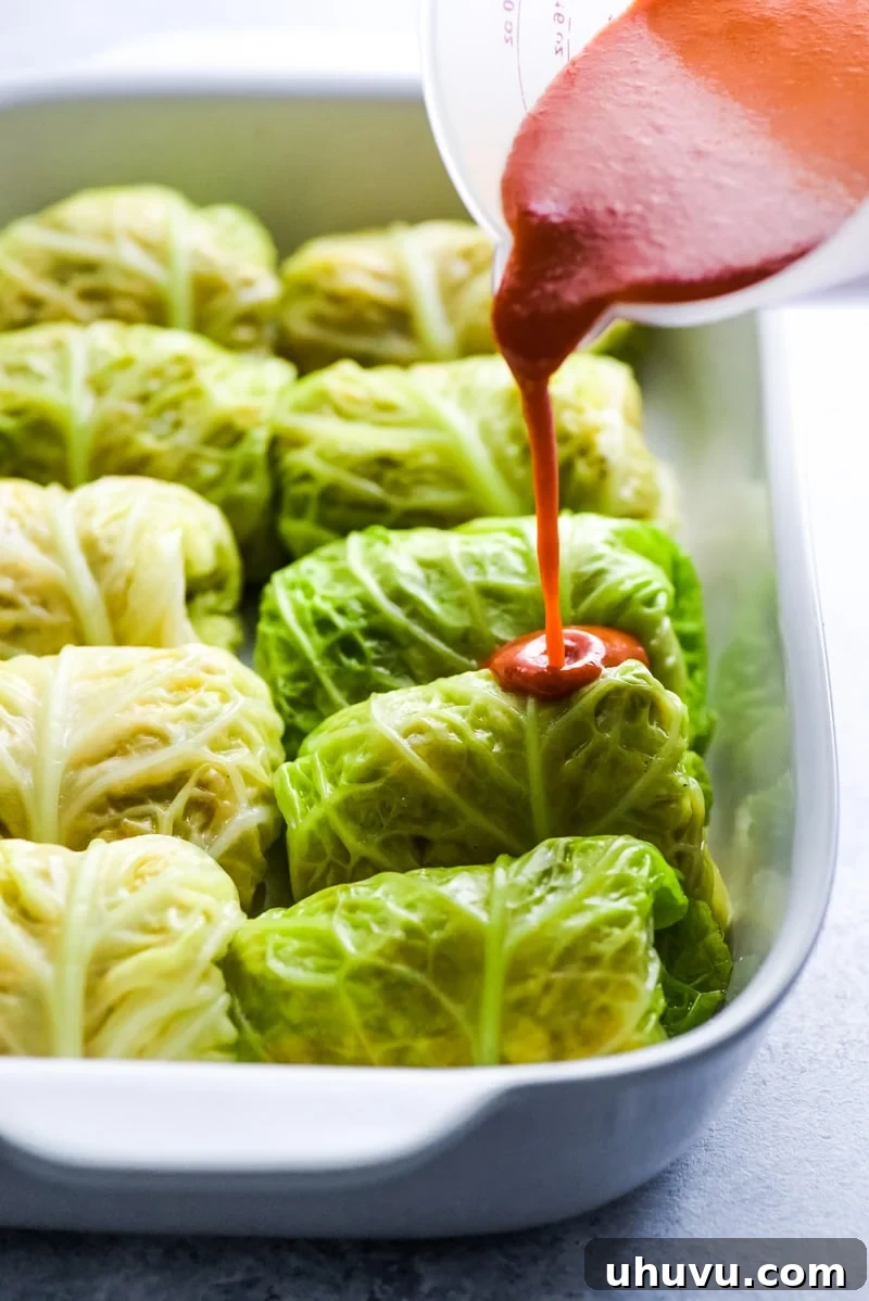 Keto Enchilada Cabbage Wraps 4 The filling for Low Carb Enchilada Cabbage Rolls features seasoned chicken, diced green chiles, and melted cheese, making a flavorful and healthy meal.