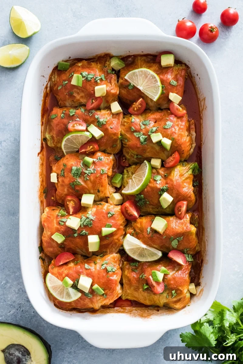 Keto Enchilada Cabbage Wraps 5 Garnishing Low Carb Enchilada Cabbage Rolls with fresh cilantro, diced tomatoes, and avocado adds color and a burst of fresh flavors.
