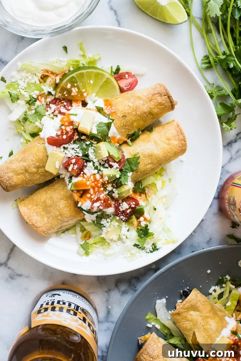 Golden-brown baked chicken taquitos served with fresh toppings